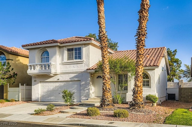 1547 Balsam Mist Ave, Las Vegas, NV 89183 - mediterranean / spanish-style home featuring a garage, stucco siding, a tiled roof, and concrete driveway