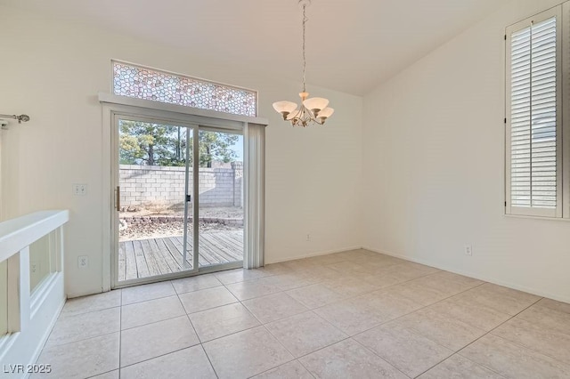 1547 Balsam Mist Ave, Las Vegas, NV 89183 - empty room featuring a chandelier, light tile patterned flooring, and high vaulted ceiling