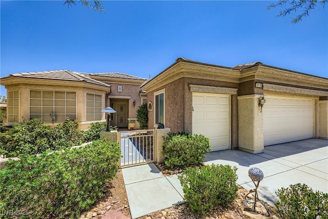 2016 Biloxi Pass, Henderson, NV 89052 - view of front of property with an attached garage, stucco siding, a gate, and concrete driveway