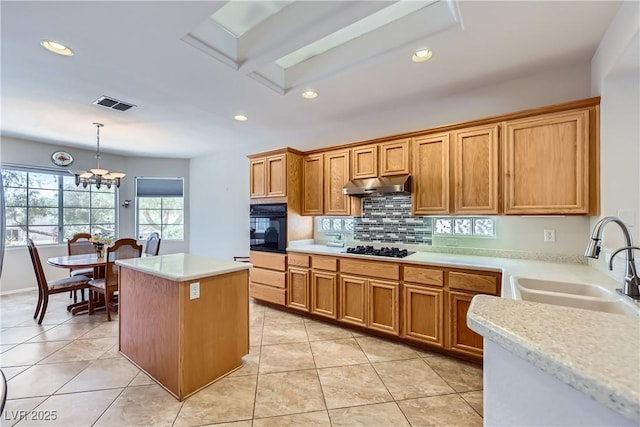 2016 Biloxi Pass, Henderson, NV 89052 - kitchen featuring black appliances, under cabinet range hood, light countertops, recessed lighting, and backsplash