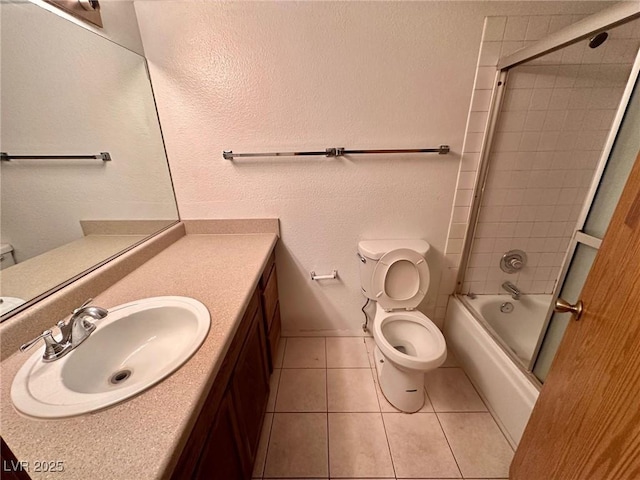 4140 Gannet Cir Unit 251, Las Vegas, NV 89103 - bathroom with tile patterned flooring, vanity, and combined bath / shower with glass door