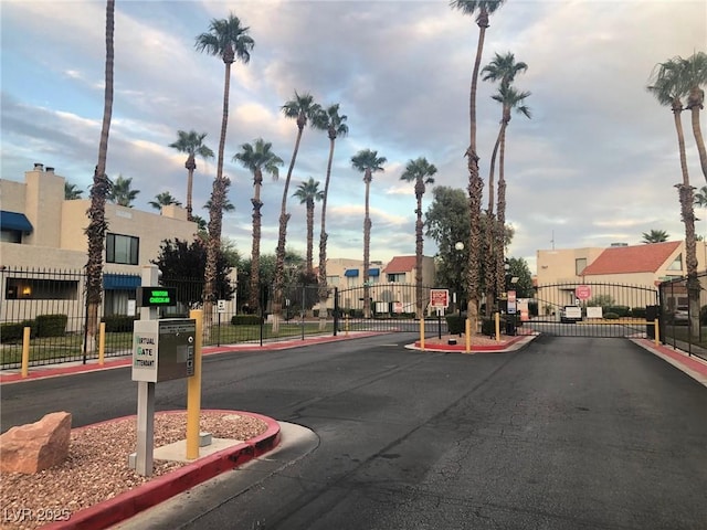 4140 Gannet Cir Unit 251, Las Vegas, NV 89103 - view of asphalt road featuring a gate, a gated entry, curbs, and a residential view