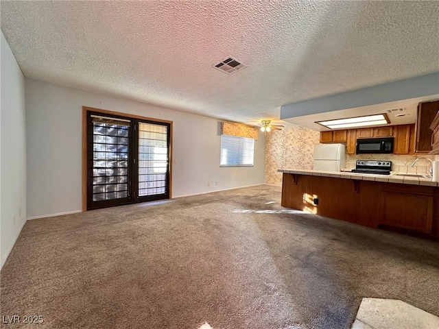 4140 Gannet Cir Unit 251, Las Vegas, NV 89103 - unfurnished living room with light carpet and a textured ceiling