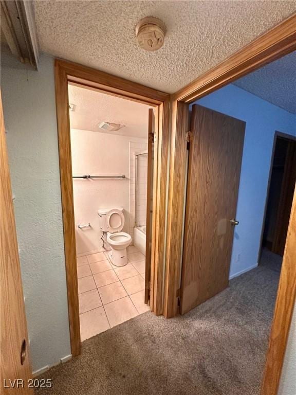 4140 Gannet Cir Unit 251, Las Vegas, NV 89103 - corridor with a textured ceiling and carpet flooring