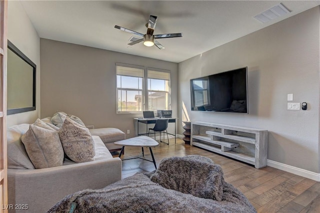 10360 Pescado Ln, Las Vegas, NV 89135 - living area featuring a ceiling fan, wood finished floors, and a desk