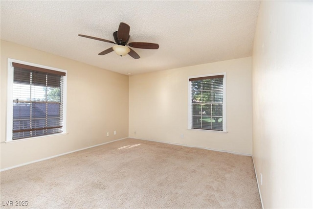 3189 Pinehurst Dr Unit B, Las Vegas, NV 89109 - unfurnished room with carpet floors, plenty of natural light, ceiling fan, and a textured ceiling