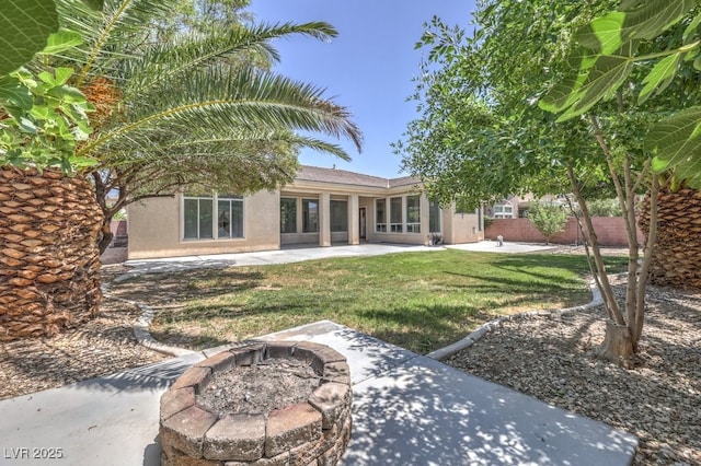 6821 Sleepy Pine St, Las Vegas, NV 89130 - rear view of property with an outdoor fire pit, a patio, and stucco siding