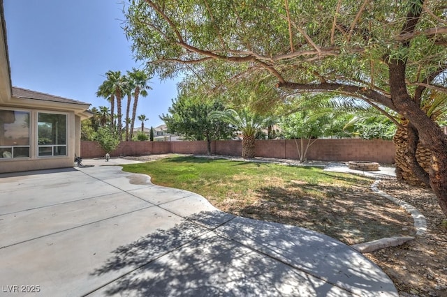 6821 Sleepy Pine St, Las Vegas, NV 89130 - fenced backyard with a fire pit and a patio