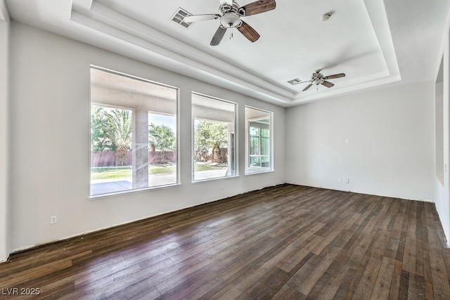 6821 Sleepy Pine St, Las Vegas, NV 89130 - empty room with a raised ceiling, ceiling fan, dark wood-style flooring, and a smoke detector