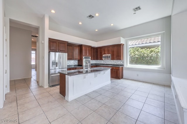 6821 Sleepy Pine St, Las Vegas, NV 89130 - kitchen featuring appliances with stainless steel finishes, healthy amount of natural light, tasteful backsplash, and recessed lighting