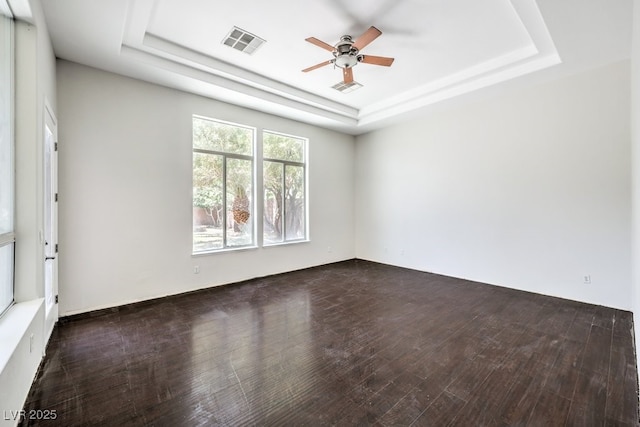 6821 Sleepy Pine St, Las Vegas, NV 89130 - unfurnished room featuring a tray ceiling, wood finished floors, and a ceiling fan