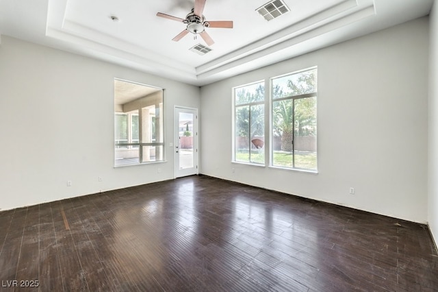 6821 Sleepy Pine St, Las Vegas, NV 89130 - unfurnished room featuring a tray ceiling, ceiling fan, and wood finished floors