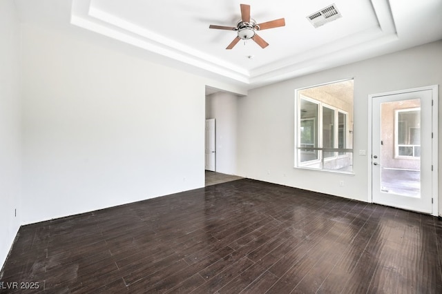 6821 Sleepy Pine St, Las Vegas, NV 89130 - empty room with a raised ceiling, a ceiling fan, and wood finished floors