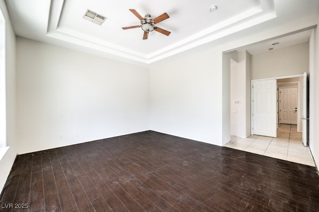 6821 Sleepy Pine St, Las Vegas, NV 89130 - spare room featuring a raised ceiling, a ceiling fan, and wood finished floors