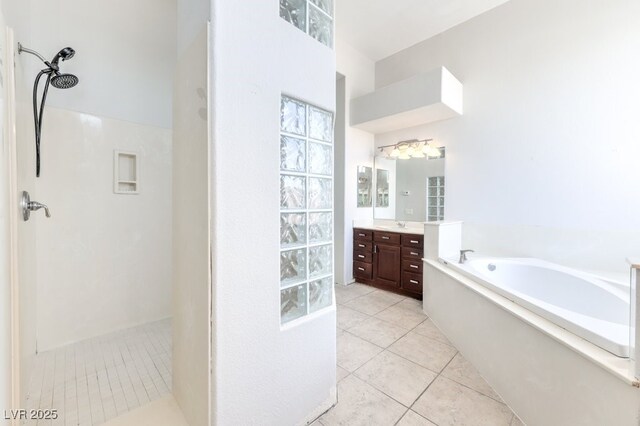6821 Sleepy Pine St, Las Vegas, NV 89130 - bathroom with walk in shower, tile patterned floors, vanity, and a garden tub