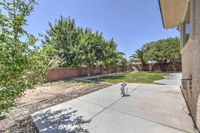6821 Sleepy Pine St, Las Vegas, NV 89130 - fenced backyard with a patio area