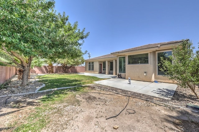 6821 Sleepy Pine St, Las Vegas, NV 89130 - back of house with a fenced backyard, a patio, and stucco siding