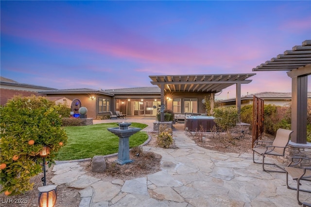 10179 Emerald Sunset Ct, Las Vegas, NV 89148 - patio terrace at dusk with a hot tub, a patio, and a pergola