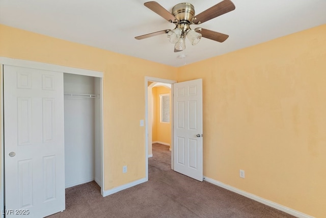 8448 Quarentina Ave, Las Vegas, NV 89149 - unfurnished bedroom with carpet, a closet, and a ceiling fan