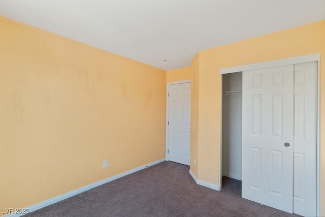 8448 Quarentina Ave, Las Vegas, NV 89149 - unfurnished bedroom featuring dark carpet and a closet