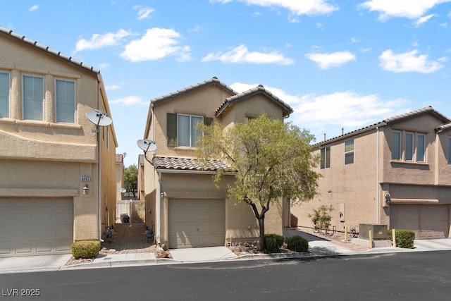 8448 Quarentina Ave, Las Vegas, NV 89149 - view of front of property featuring a tiled roof, stucco siding, and a garage