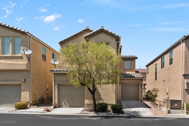 8448 Quarentina Ave, Las Vegas, NV 89149 - view of front of property with a tile roof, stucco siding, and a garage