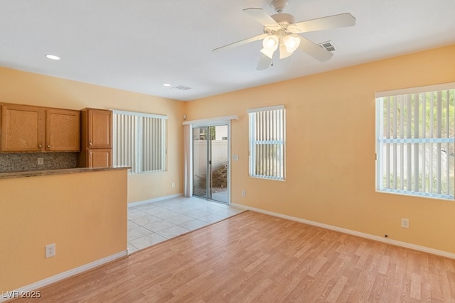 8448 Quarentina Ave, Las Vegas, NV 89149 - spare room featuring light wood-style flooring, ceiling fan, and recessed lighting