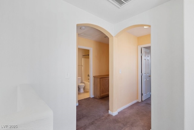 8448 Quarentina Ave, Las Vegas, NV 89149 - hallway with carpet flooring and arched walkways