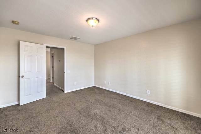 1064 Calvia St, Las Vegas, NV 89138 - spare room with dark carpet and a smoke detector