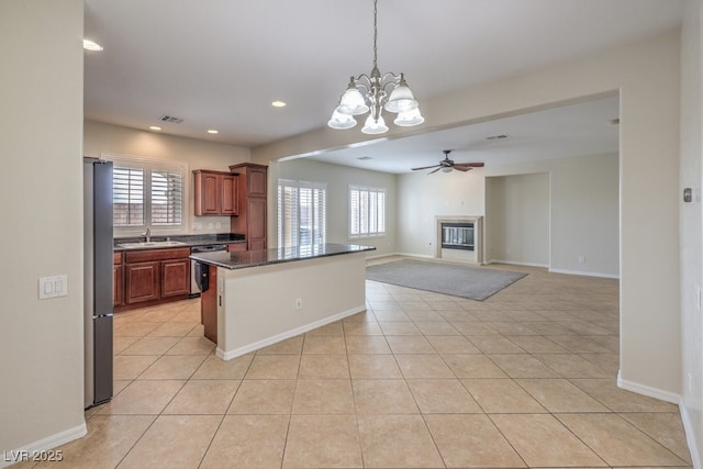 1064 Calvia St, Las Vegas, NV 89138 - kitchen with stainless steel appliances, a center island, plenty of natural light, a chandelier, and recessed lighting