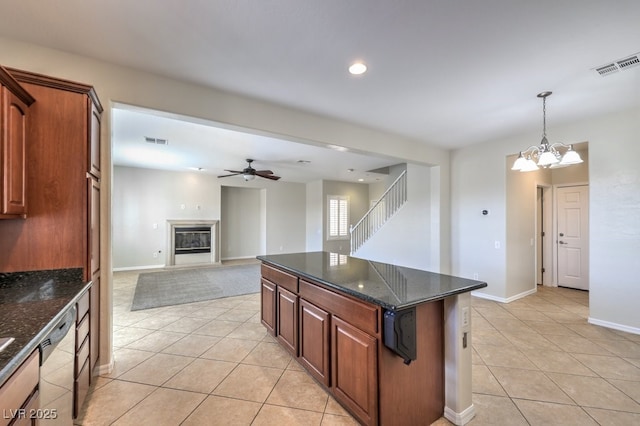 1064 Calvia St, Las Vegas, NV 89138 - kitchen with light tile patterned flooring, stainless steel dishwasher, ceiling fan, a chandelier, and recessed lighting