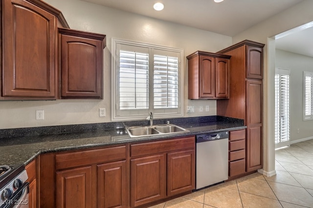 1064 Calvia St, Las Vegas, NV 89138 - kitchen with stainless steel appliances, healthy amount of natural light, light tile patterned flooring, dark stone counters, and recessed lighting