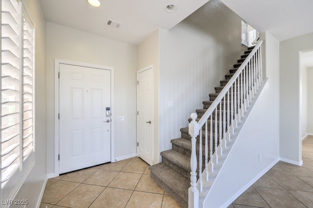 1064 Calvia St, Las Vegas, NV 89138 - entrance foyer with light tile patterned flooring, stairway, and recessed lighting