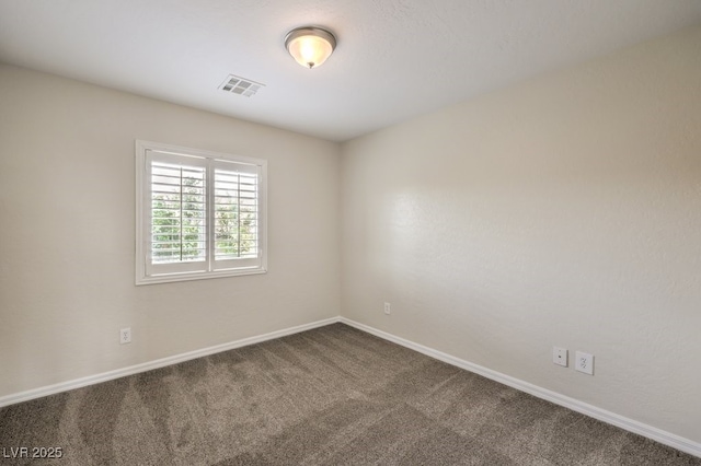 1064 Calvia St, Las Vegas, NV 89138 - empty room featuring dark colored carpet and baseboards