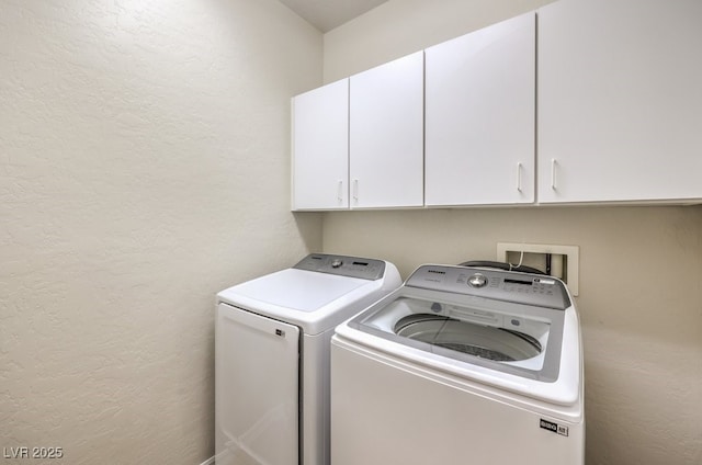 1064 Calvia St, Las Vegas, NV 89138 - washroom featuring a textured wall, cabinet space, and independent washer and dryer