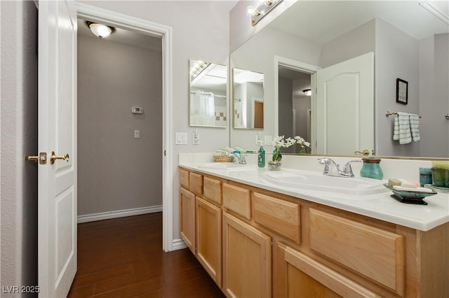 6617 Golden Bit Ave, Las Vegas, NV 89131 - full bathroom with double vanity and wood finished floors