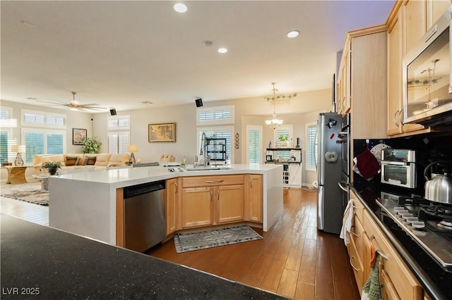 6617 Golden Bit Ave, Las Vegas, NV 89131 - kitchen featuring appliances with stainless steel finishes, light brown cabinets, open floor plan, recessed lighting, and dark wood-style floors