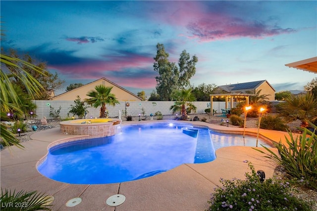 6617 Golden Bit Ave, Las Vegas, NV 89131 - pool at dusk with a fenced backyard, a patio area, a pool with connected hot tub, and a gazebo
