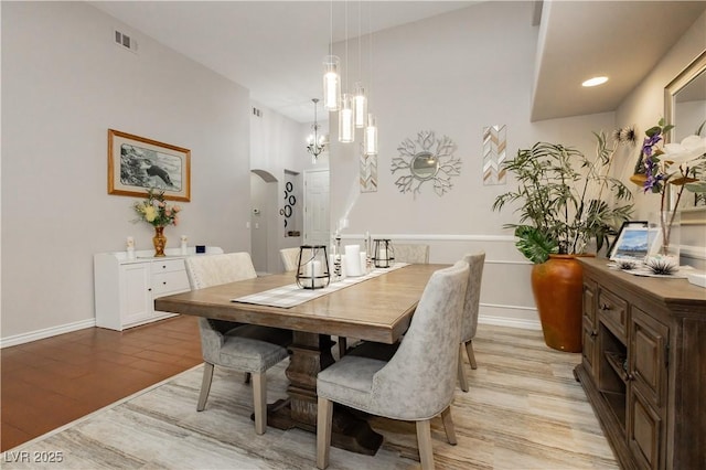 6617 Golden Bit Ave, Las Vegas, NV 89131 - dining space featuring light wood-type flooring and arched walkways
