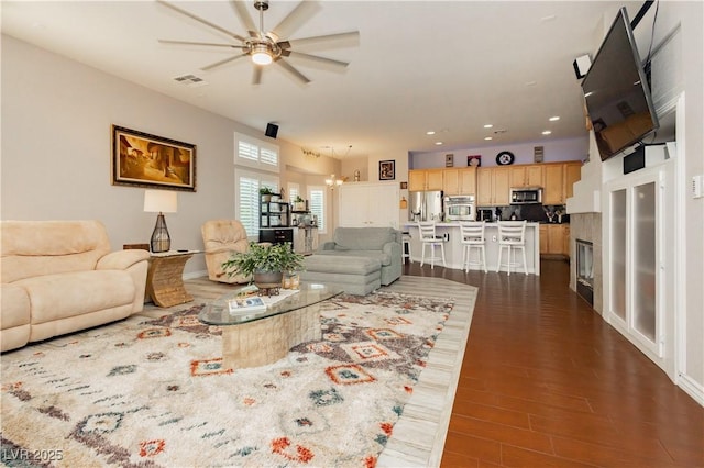 6617 Golden Bit Ave, Las Vegas, NV 89131 - living room featuring ceiling fan, dark wood-type flooring, recessed lighting, and a chandelier