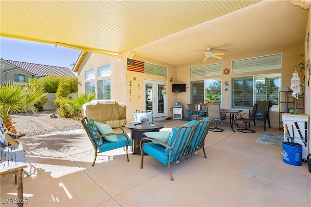 6617 Golden Bit Ave, Las Vegas, NV 89131 - view of patio with a fire pit, french doors, a ceiling fan, outdoor dining space, and area for grilling