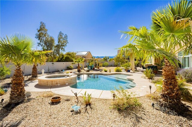 6617 Golden Bit Ave, Las Vegas, NV 89131 - view of pool with a patio area, a fenced backyard, and a pool with connected hot tub