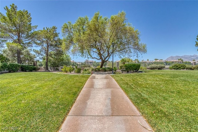 8825 Rozetta Ct, Las Vegas, NV 89134 - view of community featuring a lawn and a mountain view