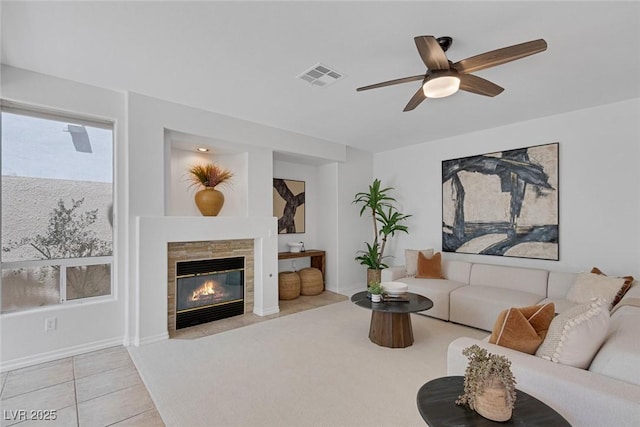 8825 Rozetta Ct, Las Vegas, NV 89134 - tiled living area with a ceiling fan and a tile fireplace