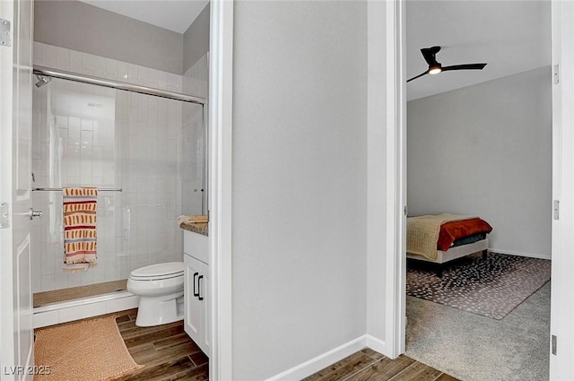 10161 Bismarck Palms Ave, Las Vegas, NV 89166 - ensuite bathroom with wood finished floors, a shower stall, vanity, and a ceiling fan
