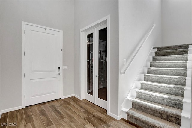 10161 Bismarck Palms Ave, Las Vegas, NV 89166 - entryway with stairway, wood finished floors, and french doors