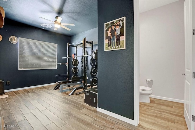 10161 Bismarck Palms Ave, Las Vegas, NV 89166 - workout room with ceiling fan, wood finished floors, and a textured ceiling