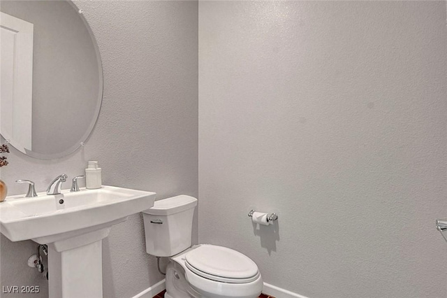 10161 Bismarck Palms Ave, Las Vegas, NV 89166 - half bathroom with toilet and baseboards
