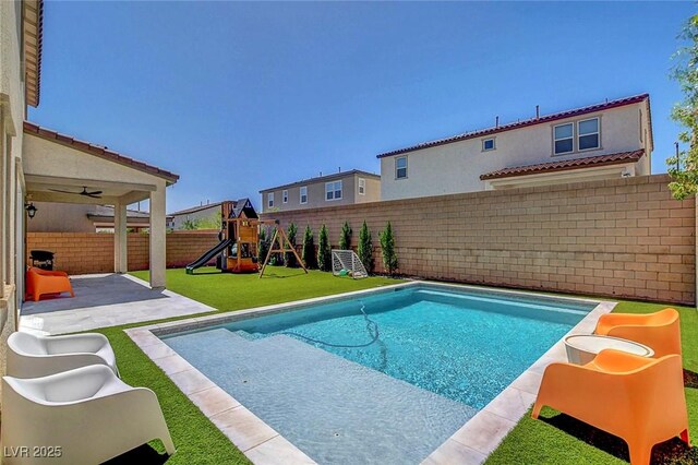 10161 Bismarck Palms Ave, Las Vegas, NV 89166 - view of pool with a fenced backyard, a playground, and a patio area