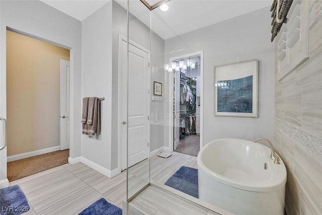 5801 Exbury Gardens Ct, Las Vegas, NV 89118 - bathroom featuring a freestanding bath and a walk in closet